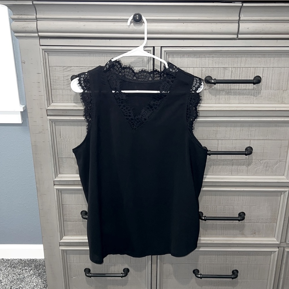 Sleeveless black lace trim top. Size L/XL.